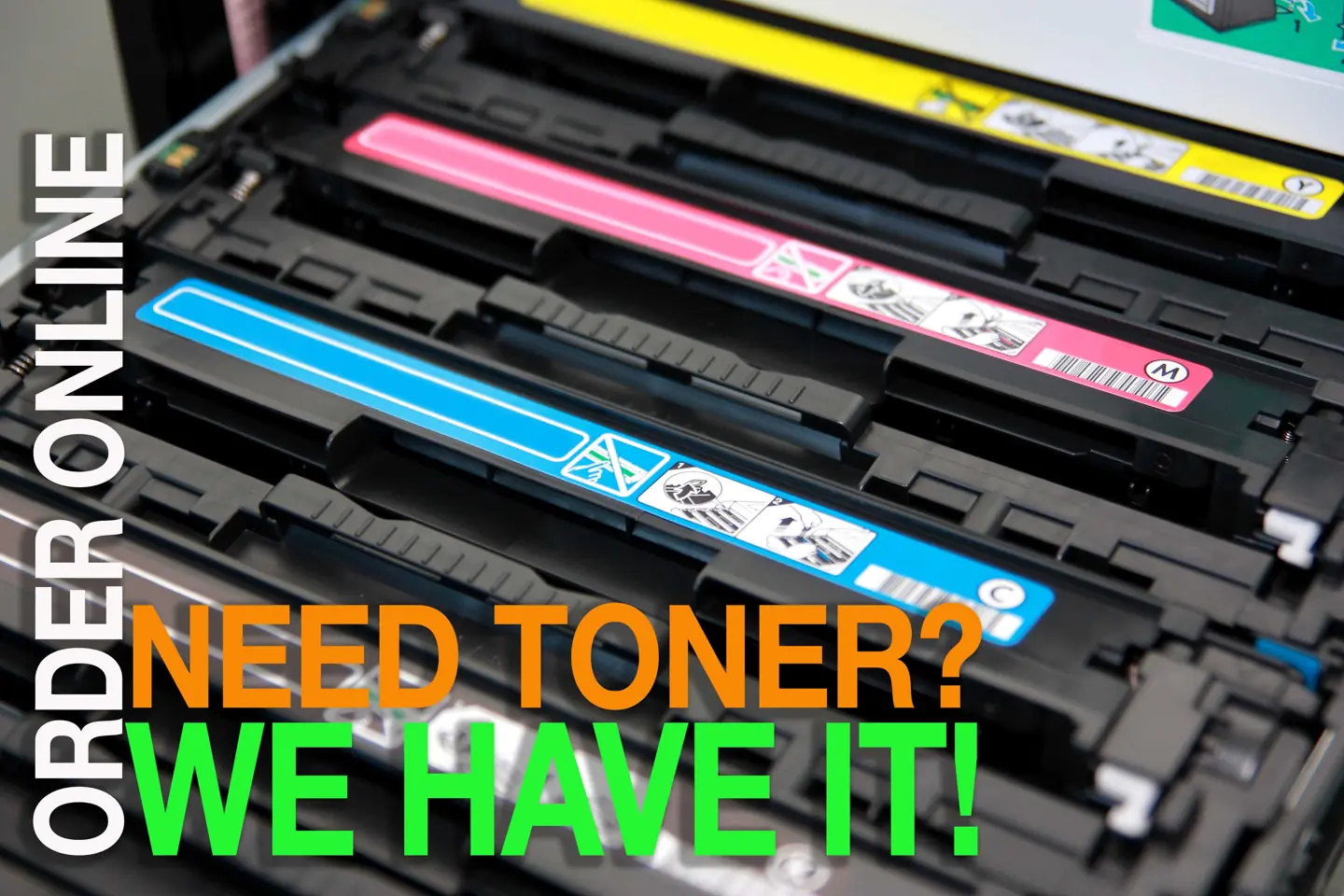 Cyan, magenta and yellow copier toner cartridges installed in a printer — Need toner? We have it! Order online